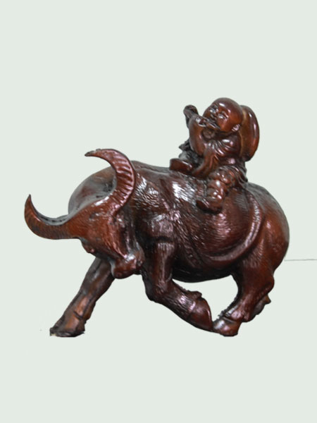 Fluting Boy on Buffalo Resin Figurine
