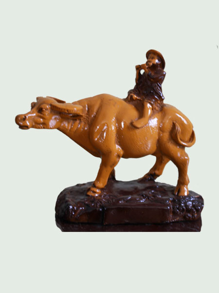 Fluting Boy on Buffalo Resin Figurine